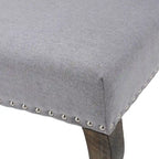 Poltrona d'accento Niclas Wing Back con borchie in tessuto by
