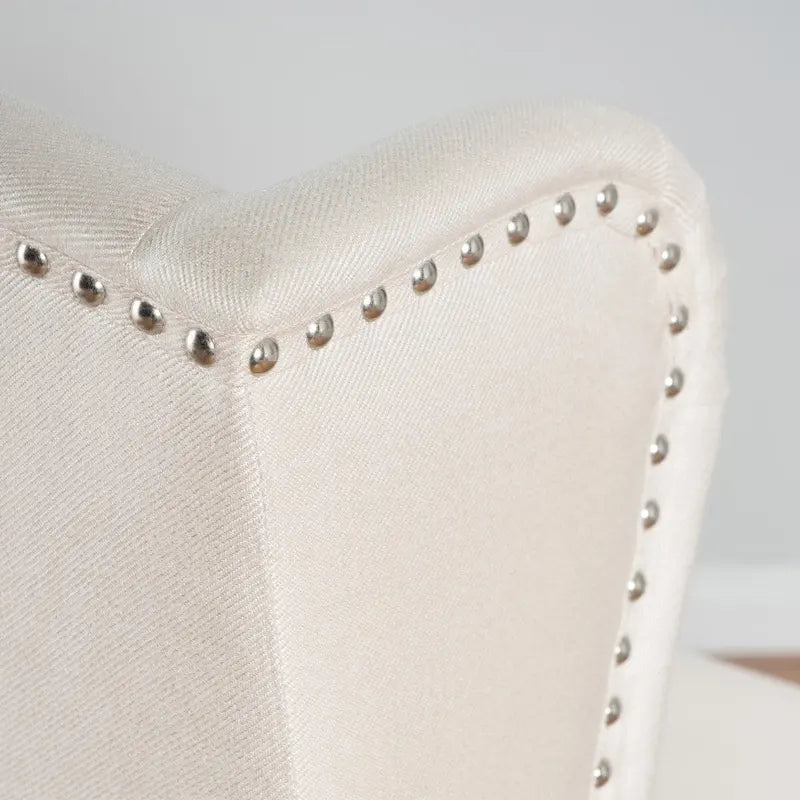 Poltrona d'accento Niclas Wing Back con borchie in tessuto by